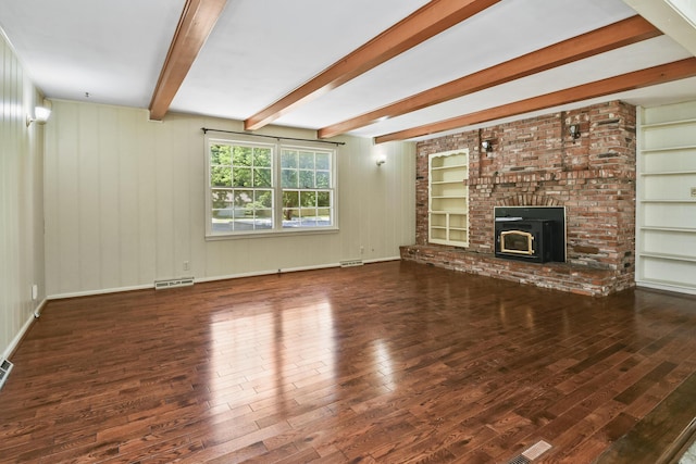 3011 E Lamonta Dr, Springfield, MO 65804 - unfurnished living room with wood finished floors, beam ceiling, built in features, and a fireplace