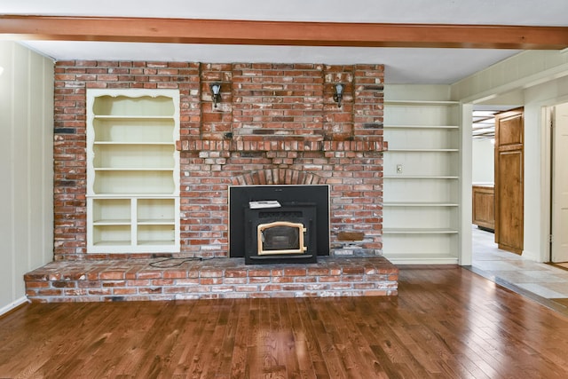 3011 E Lamonta Dr, Springfield, MO 65804 - unfurnished living room with wood-type flooring, built in features, a fireplace, and beam ceiling
