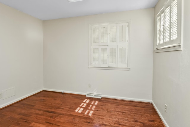 3011 E Lamonta Dr, Springfield, MO 65804 - unfurnished room featuring wood finished floors and baseboards