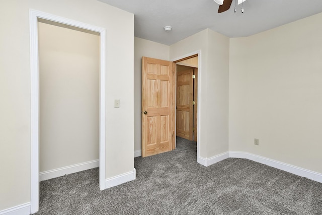 3011 E Lamonta Dr, Springfield, MO 65804 - unfurnished bedroom featuring dark colored carpet and a ceiling fan