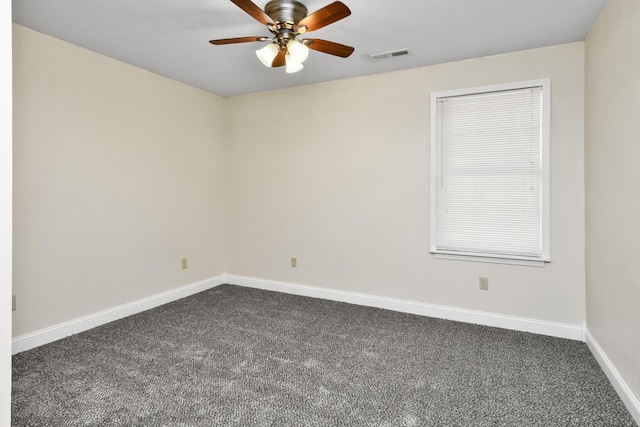 3011 E Lamonta Dr, Springfield, MO 65804 - spare room featuring dark colored carpet and a ceiling fan