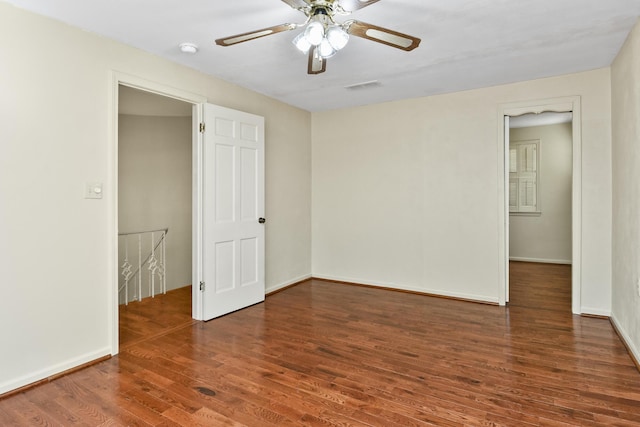 3011 E Lamonta Dr, Springfield, MO 65804 - unfurnished room featuring wood finished floors, a ceiling fan, and a smoke detector