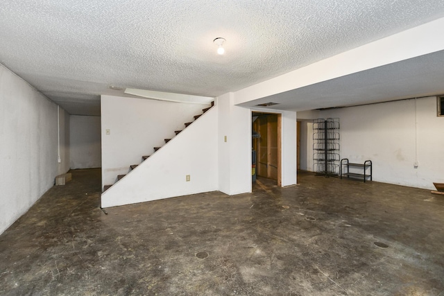 3011 E Lamonta Dr, Springfield, MO 65804 - finished below grade area featuring stairway and a textured ceiling