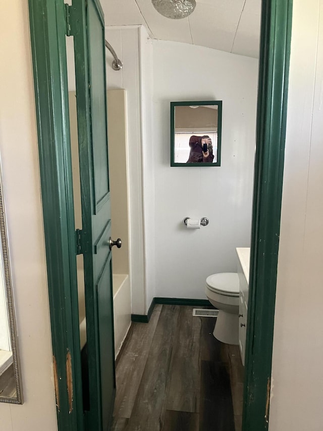 full bathroom featuring vanity, toilet, wood-type flooring, and tub / shower combination