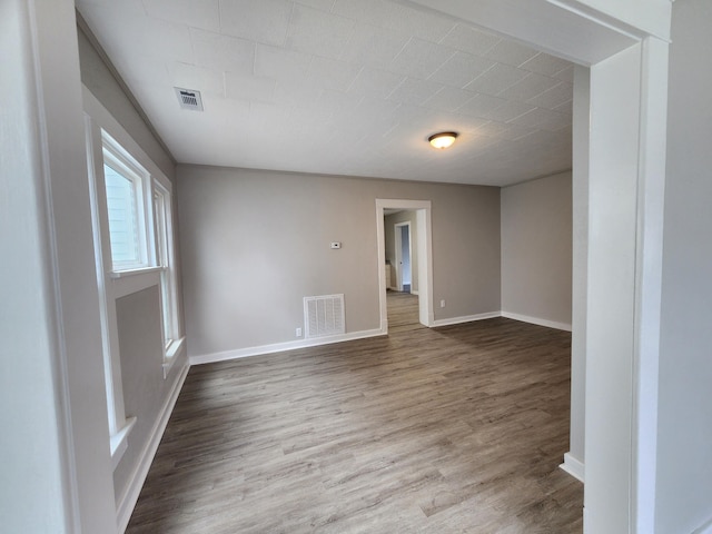 spare room featuring hardwood / wood-style floors