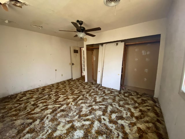 unfurnished bedroom with carpet and ceiling fan