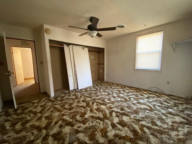 unfurnished bedroom with carpet flooring and ceiling fan