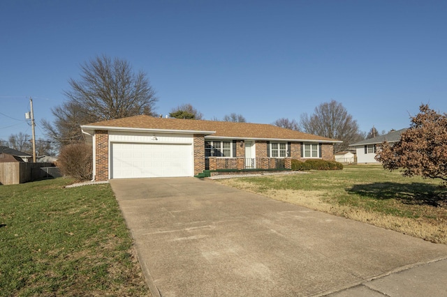 ranch-style house with a garage and a front lawn