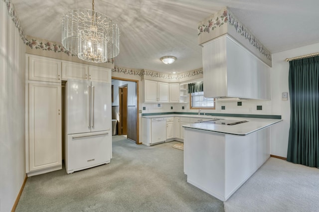 kitchen with light carpet, white appliances, decorative light fixtures, an inviting chandelier, and white cabinets