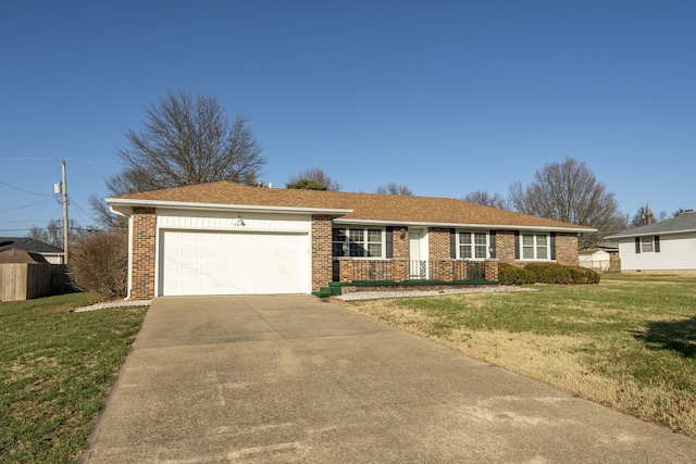 ranch-style home with a garage and a front lawn