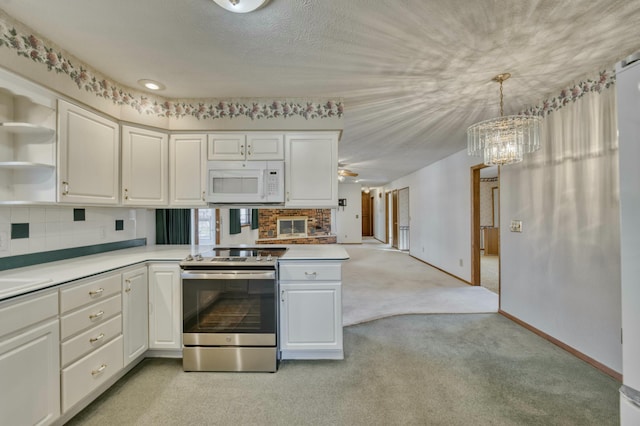 kitchen featuring decorative light fixtures, white cabinetry, light colored carpet, and stainless steel electric range oven