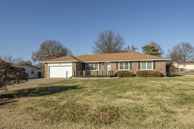 ranch-style house with a garage and a front yard