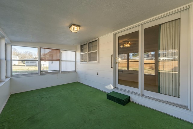 unfurnished sunroom featuring plenty of natural light