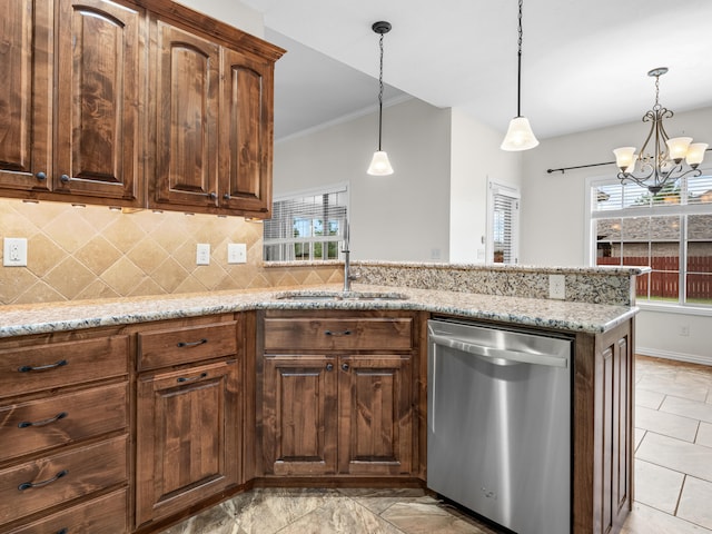 kitchen featuring sink, dishwasher, light stone countertops, and an inviting chandelier