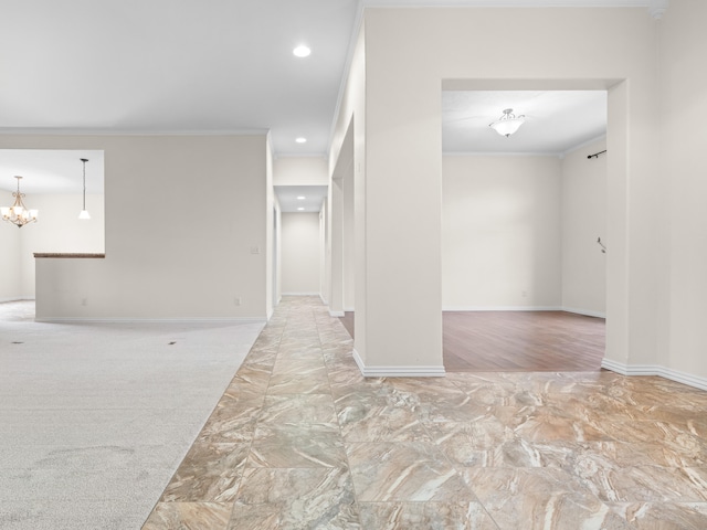 unfurnished room with an inviting chandelier and ornamental molding