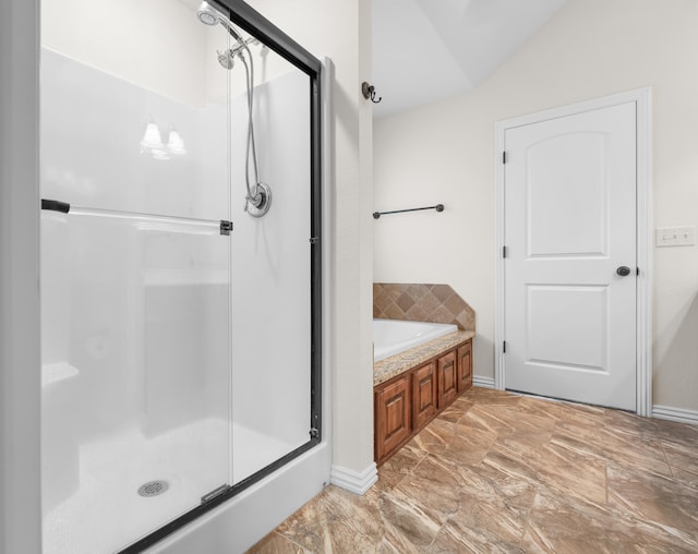 bathroom with plus walk in shower and vaulted ceiling