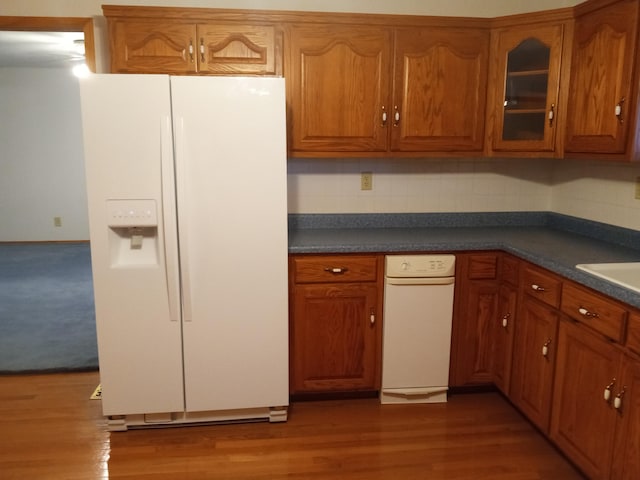 kitchen with white refrigerator with ice dispenser and dark hardwood / wood-style flooring