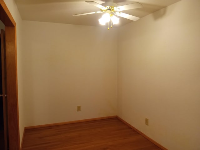 unfurnished room featuring hardwood / wood-style floors and ceiling fan