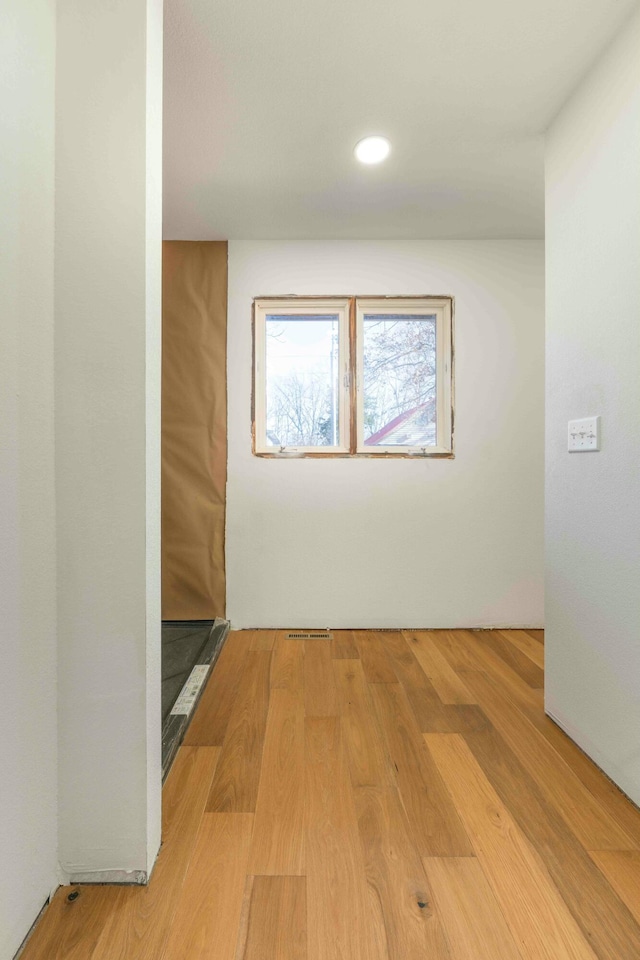 spare room with light hardwood / wood-style flooring