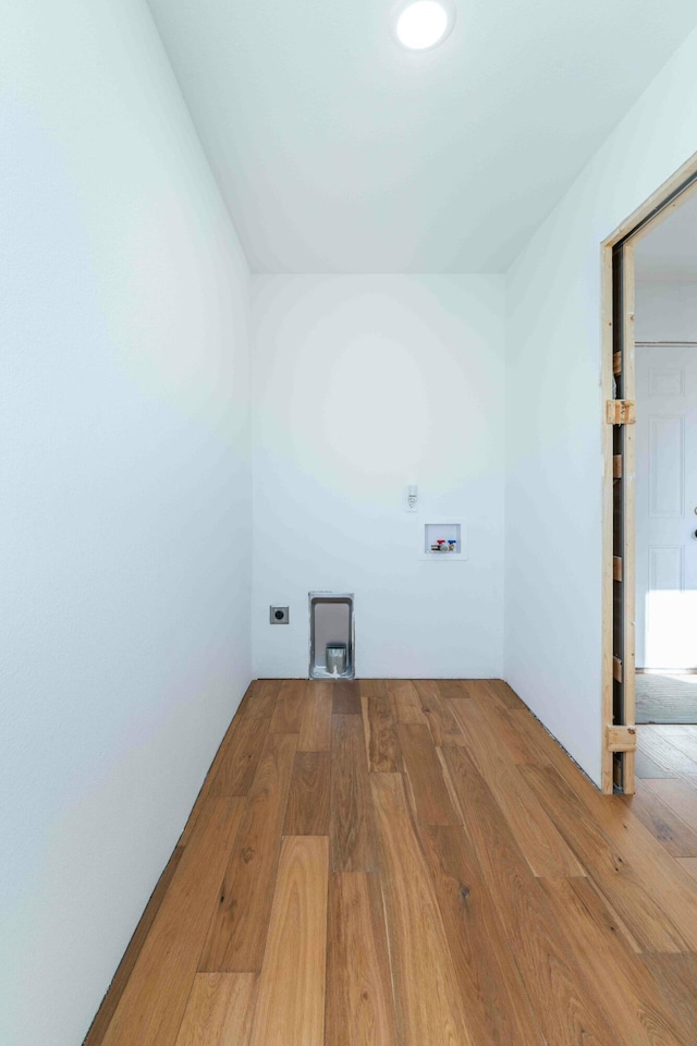 laundry area featuring hardwood / wood-style flooring, hookup for an electric dryer, and hookup for a washing machine