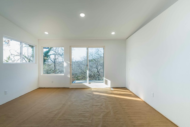 empty room with light colored carpet