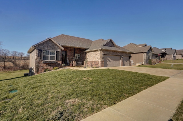 view of front of house with a front yard and a garage