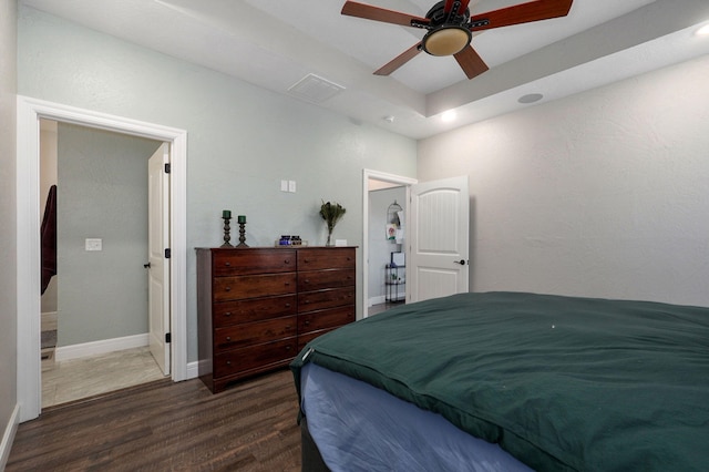 bedroom featuring ceiling fan and dark wood-type flooring