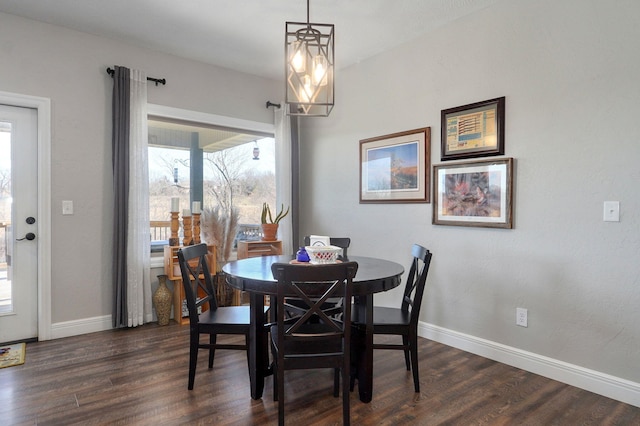 dining space featuring dark hardwood / wood-style floors