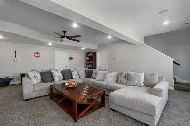 carpeted living room featuring ceiling fan