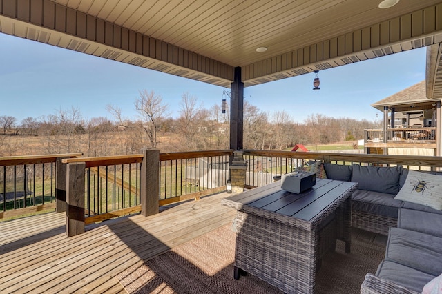 wooden terrace with outdoor lounge area