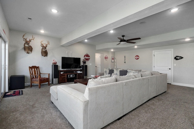 carpeted living room with beamed ceiling and ceiling fan