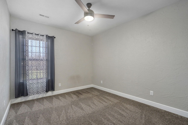 empty room with carpet floors and ceiling fan