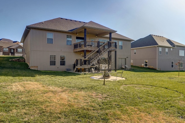 back of property featuring a lawn and a deck