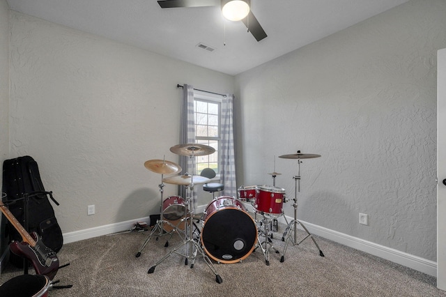 playroom with ceiling fan and carpet floors