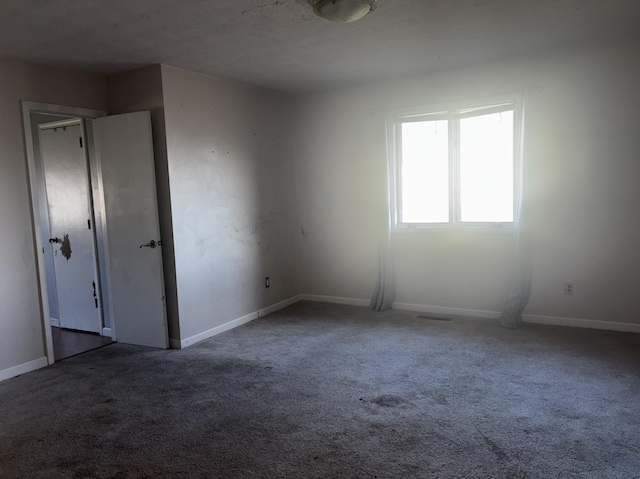 spare room featuring carpet flooring