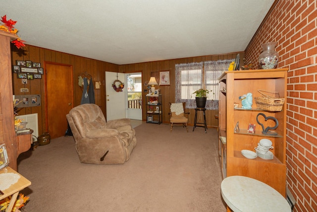 living room featuring light colored carpet and wooden walls