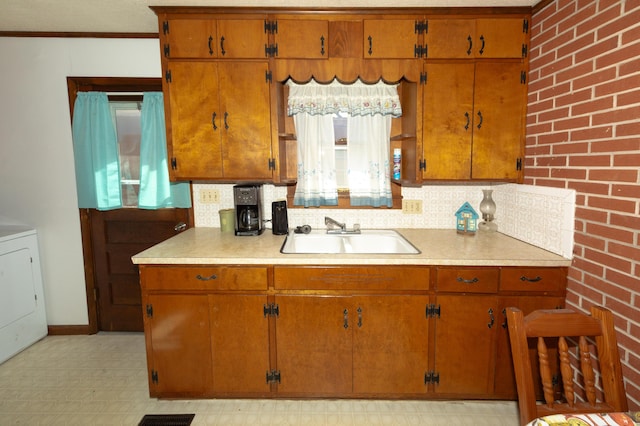 kitchen with sink and washer / clothes dryer