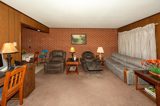 carpeted living room featuring wooden walls and brick wall