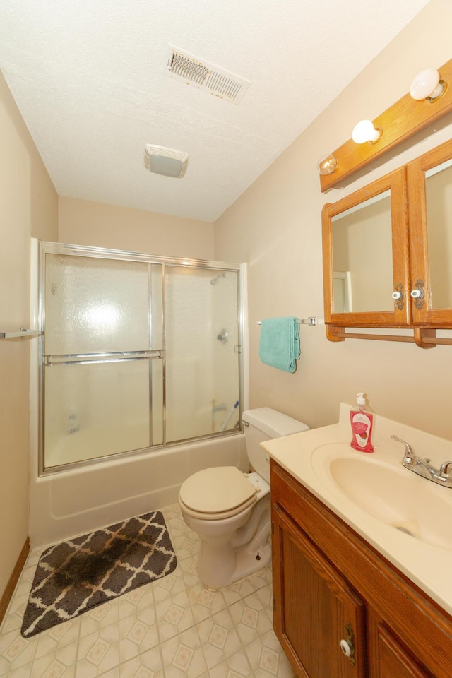 full bathroom with vanity, toilet, and enclosed tub / shower combo