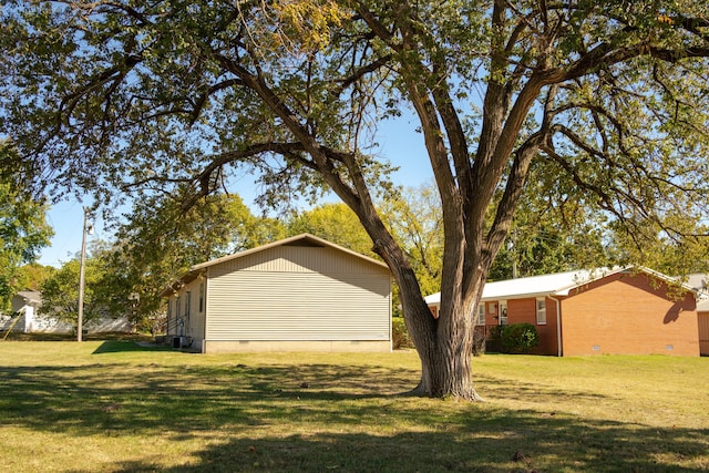 view of property exterior with a lawn