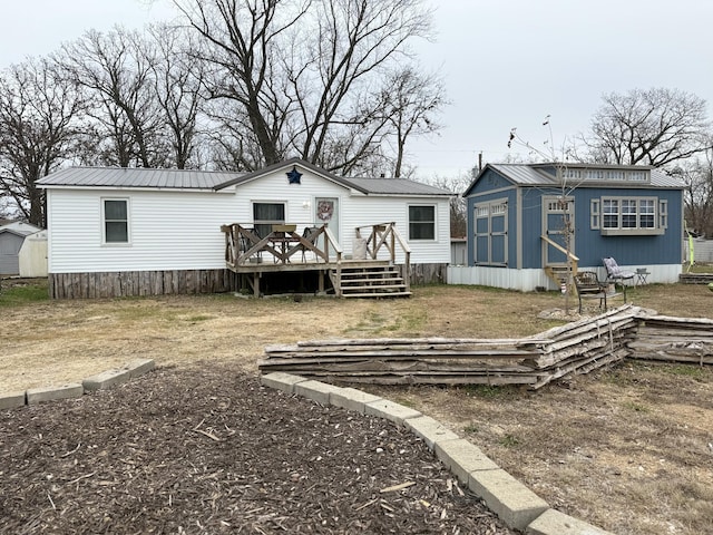 rear view of property with a deck