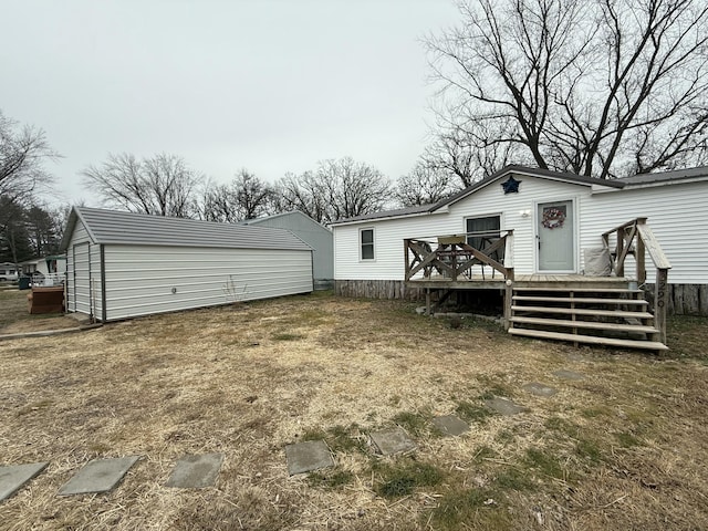 rear view of property with a wooden deck