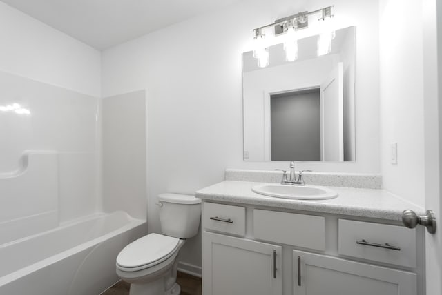 full bathroom featuring shower / washtub combination, vanity, and toilet