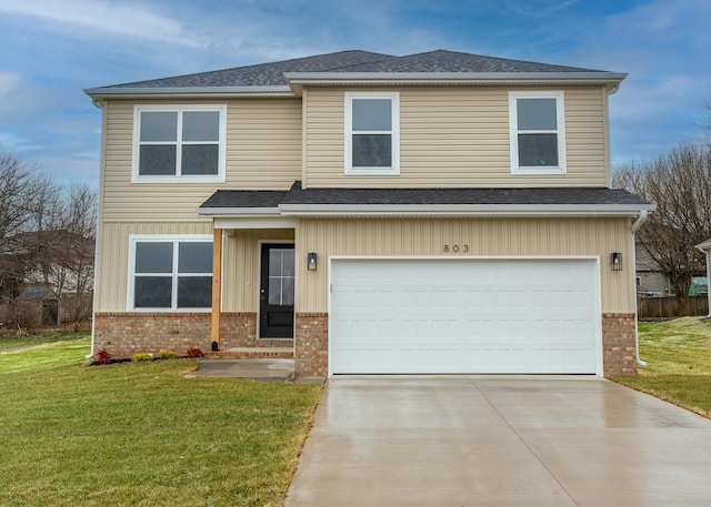 view of front facade featuring a garage and a front lawn