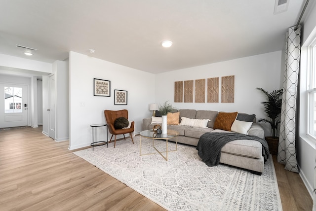 living room with light hardwood / wood-style flooring