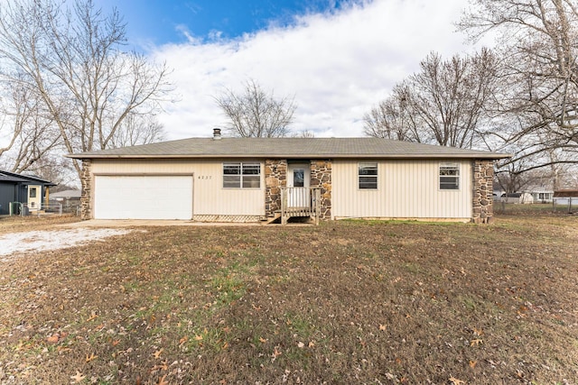 single story home with a front lawn and a garage