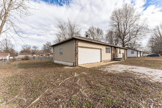 view of side of property with a garage