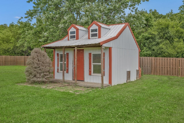 view of outdoor structure with a lawn