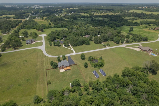 birds eye view of property with a rural view