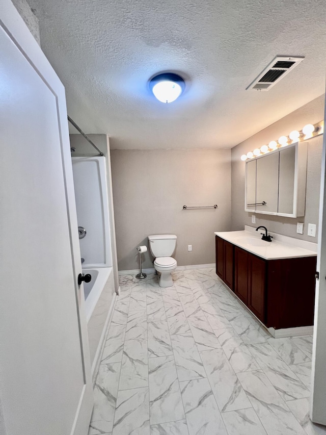 full bathroom featuring vanity, toilet, washtub / shower combination, and a textured ceiling